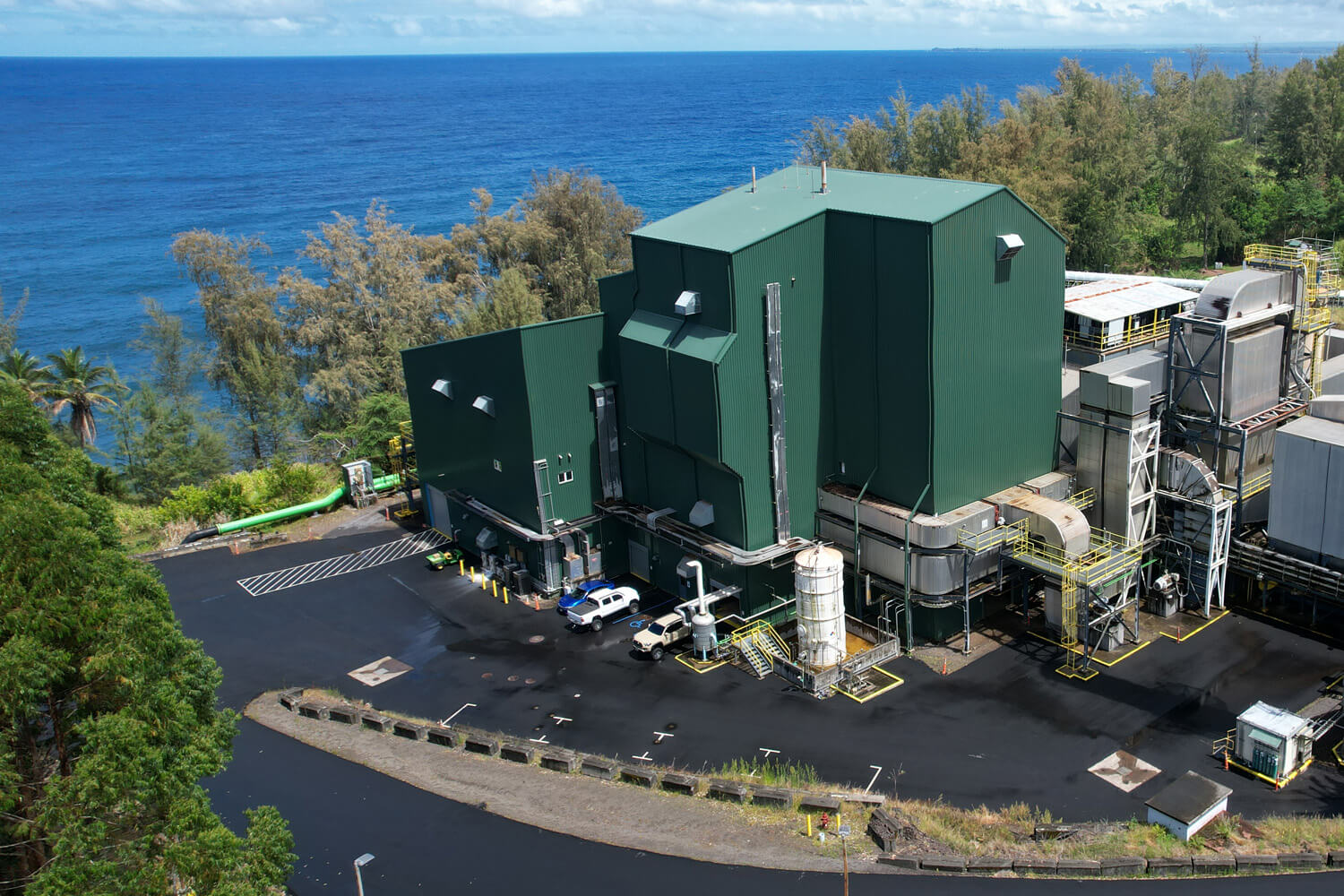 Side shot of the building with the ocean in the background.